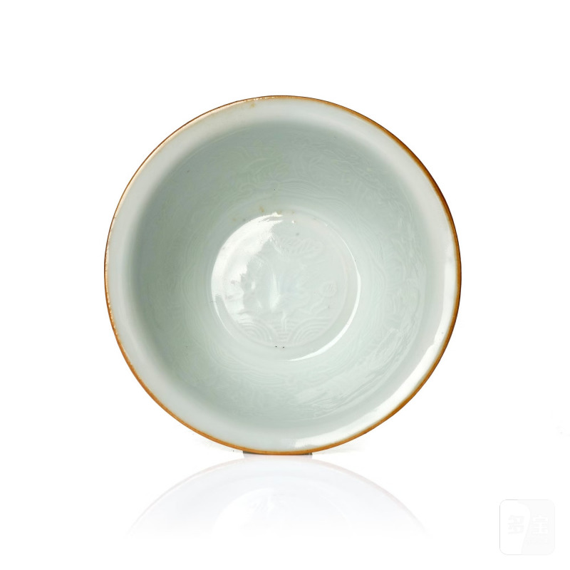 A moulded white-glazed 'anhua' decorated cup,